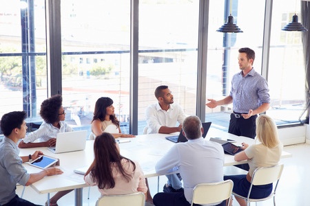 41393282 - businessman presenting to colleagues at a meeting